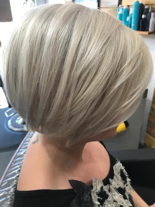 Hair Extensions photo, Denver Colorado. Icy blonde with an asymmetrical bob, perfect to reshape into(..)